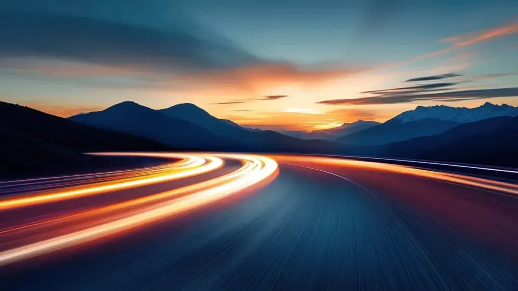 Curved road through mountains at sunset, symbolising Long Distance Furniture Movers